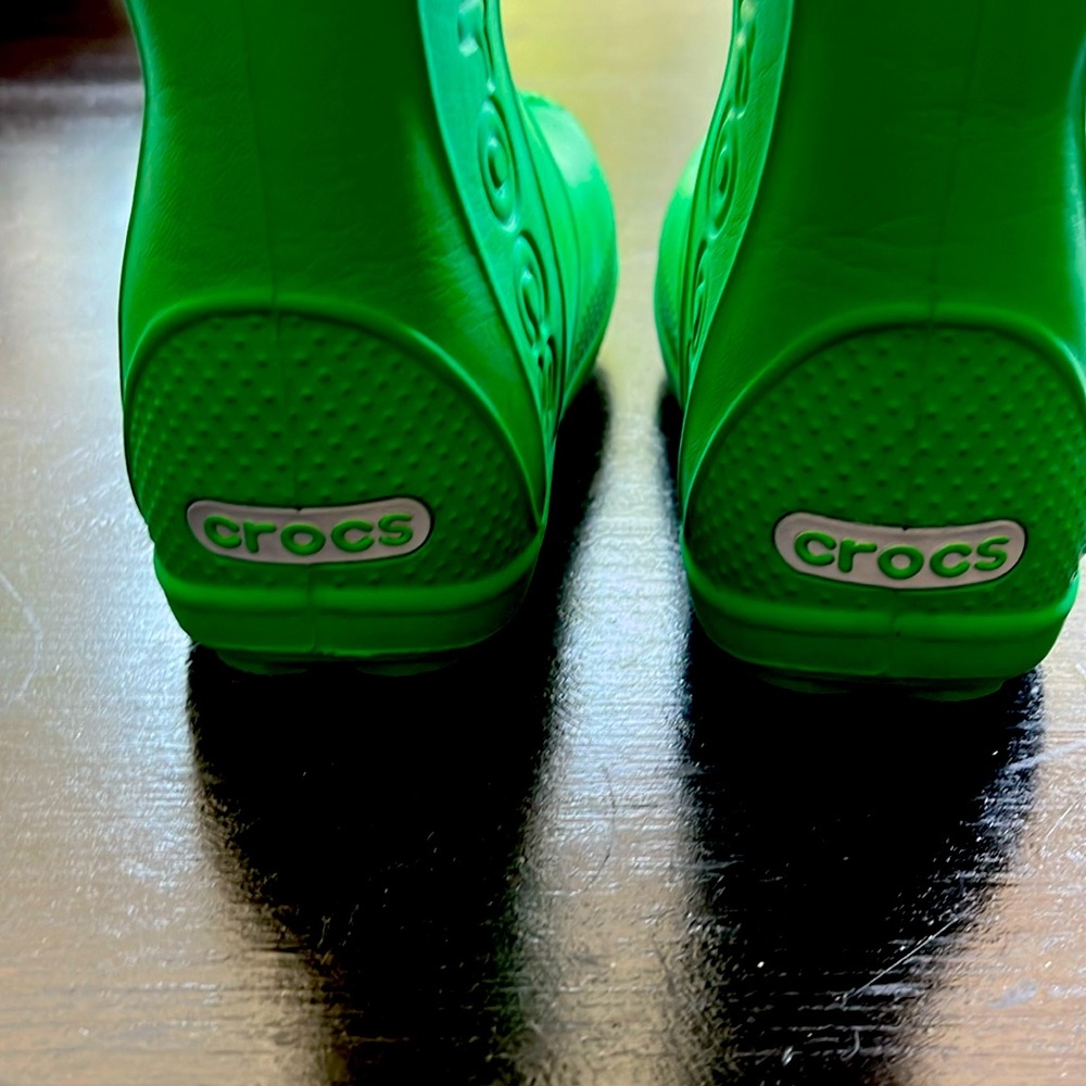 Child’s size 7 Crocs rain boots. Never worn. Green and super lightweight